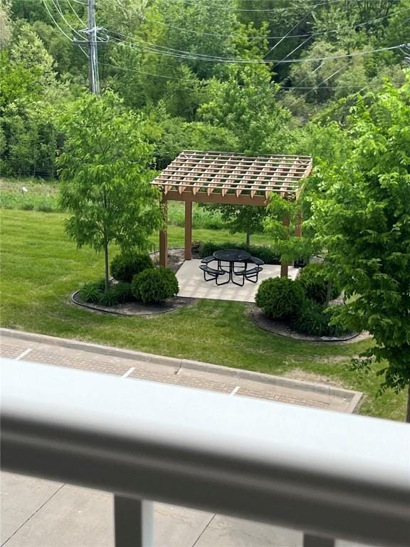 view of home's community featuring a patio area and a yard