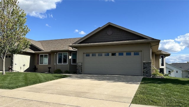 3455 Granger Ave, Marion, IA 52302 - view of front facade featuring a garage, a front lawn, stone siding, and concrete driveway