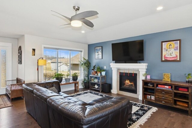 living room with a fireplace, recessed lighting, wood finished floors, and ceiling fan
