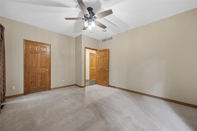 7012 Deer Horn Trl NE, Cedar Rapids, IA 52411 - unfurnished bedroom with light carpet, baseboards, and ceiling fan