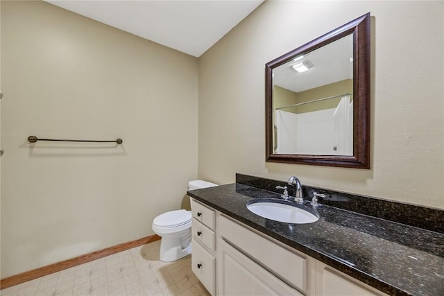 7012 Deer Horn Trl NE, Cedar Rapids, IA 52411 - full bathroom with vanity, toilet, a shower, and baseboards
