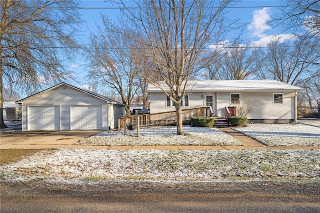 206 E Jackson St, Grandview, IA 52752 - ranch-style house featuring a garage, a wooden deck, and an outdoor structure