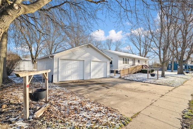 206 E Jackson St, Grandview, IA 52752 - view of side of home featuring a detached garage and an outdoor structure