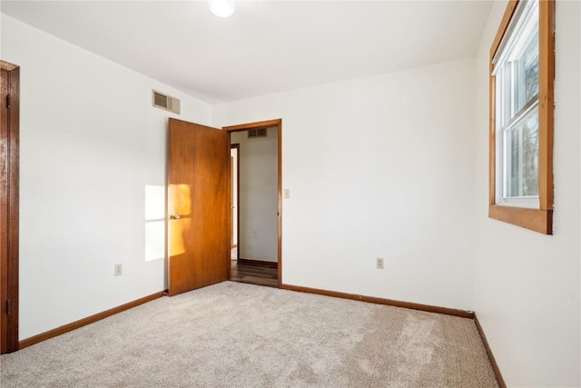 206 E Jackson St, Grandview, IA 52752 - spare room with visible vents, baseboards, and carpet floors