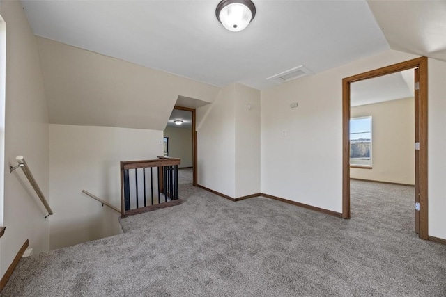 bonus room with baseboards, vaulted ceiling, visible vents, and carpet floors