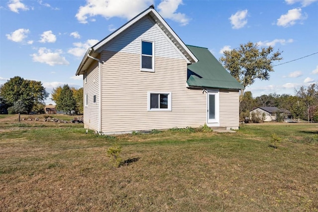 back of property with a yard