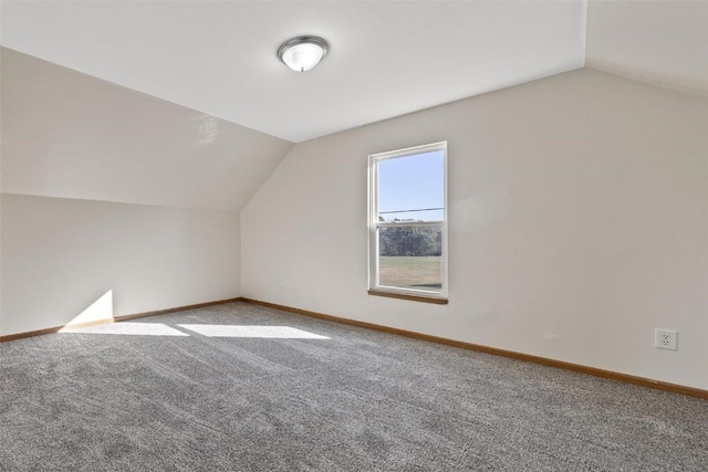 bonus room featuring carpet, lofted ceiling, and baseboards