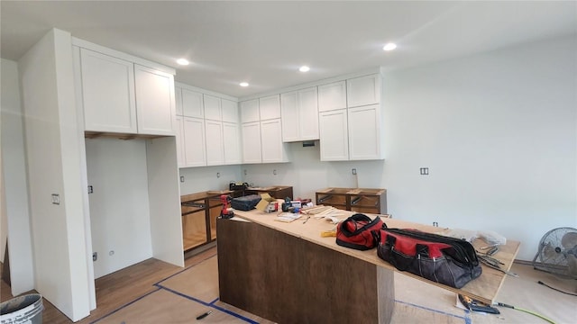 9124 Grand Oaks Dr NE, Cedar Rapids, IA 52402 - kitchen with white cabinets, recessed lighting, and light wood finished floors