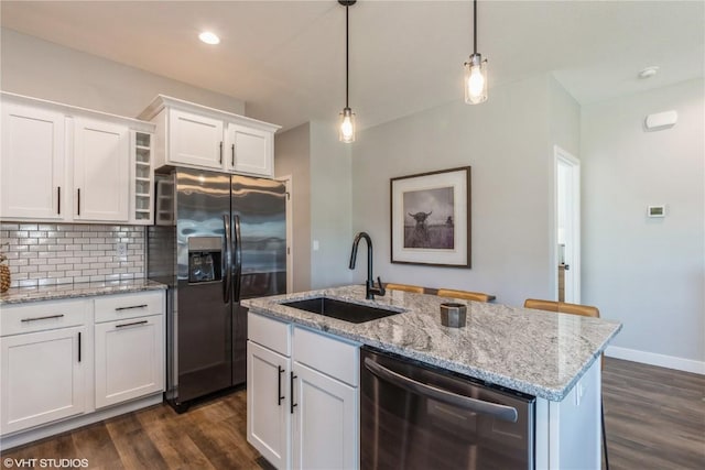 kitchen with white cabinetry, a sink, dark wood finished floors, and stainless steel appliances