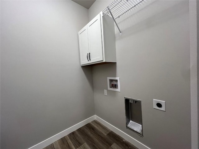 clothes washing area featuring electric dryer hookup, cabinet space, hookup for a washing machine, baseboards, and dark wood-style floors