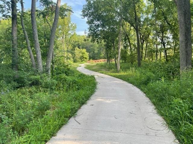 view of home's community with a wooded view