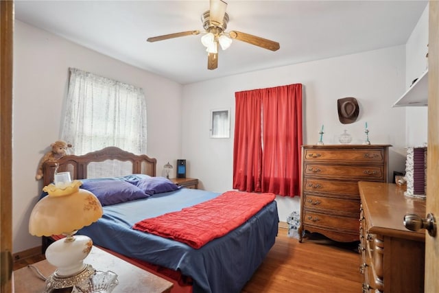 608 W 13th St, Vinton, IA 52349 - bedroom featuring wood finished floors and ceiling fan