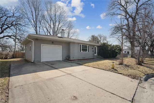 ranch-style house featuring a chimney, driveway, fence, and an attached garage