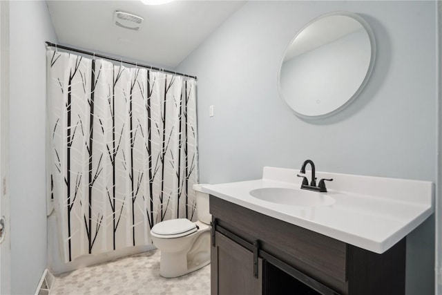 full bathroom featuring shower / bath combo, toilet, and vanity