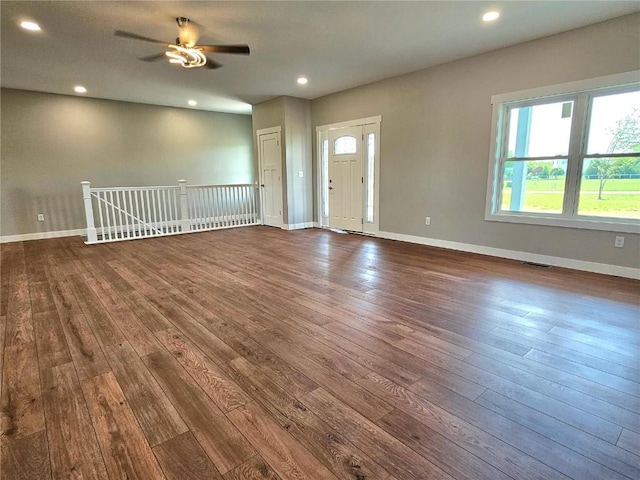7936 217th Ave, Martelle, IA 52305 - unfurnished living room with dark wood-type flooring, ceiling fan, baseboards, and recessed lighting