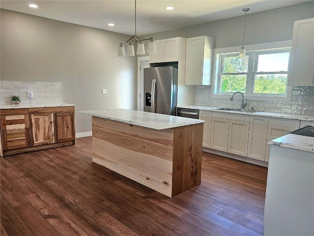 7936 217th Ave, Martelle, IA 52305 - kitchen featuring appliances with stainless steel finishes, a sink, tasteful backsplash, dark wood-style flooring, and recessed lighting