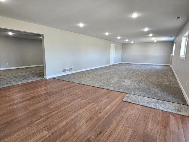 7936 217th Ave, Martelle, IA 52305 - spare room featuring baseboards, wood finished floors, and recessed lighting