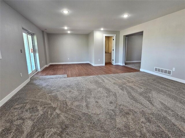 7936 217th Ave, Martelle, IA 52305 - spare room featuring carpet floors, baseboards, and recessed lighting