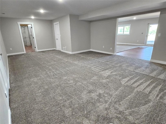 7936 217th Ave, Martelle, IA 52305 - carpeted spare room featuring baseboards and recessed lighting