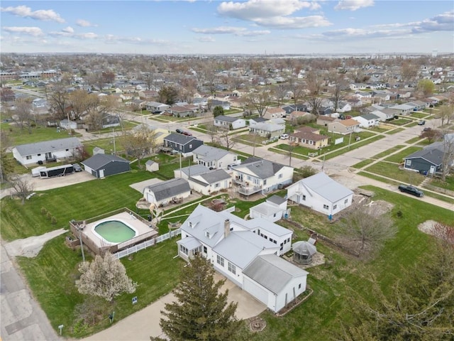 birds eye view of property with a residential view