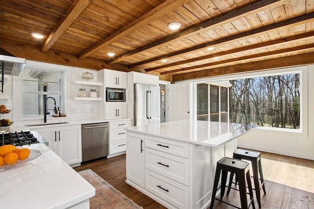 kitchen with dark wood-style flooring, stainless steel appliances, wooden ceiling, and open shelves