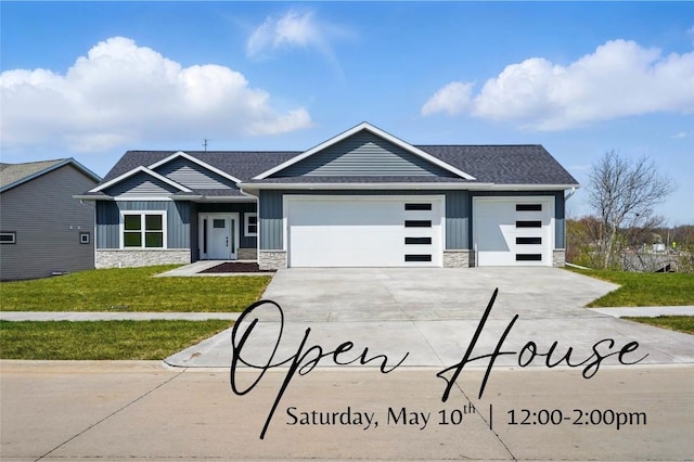 878 Silver Ln, Iowa City, IA 52245 - ranch-style house with board and batten siding, a garage, concrete driveway, stone siding, and a front lawn