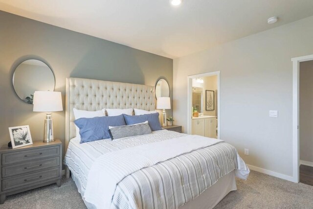 707 Thomas St, Tiffin, IA 52340 - bedroom with baseboards, carpet flooring, and ensuite bath
