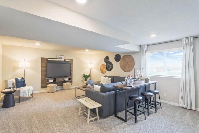 707 Thomas St, Tiffin, IA 52340 - living room with carpet floors, baseboards, and recessed lighting