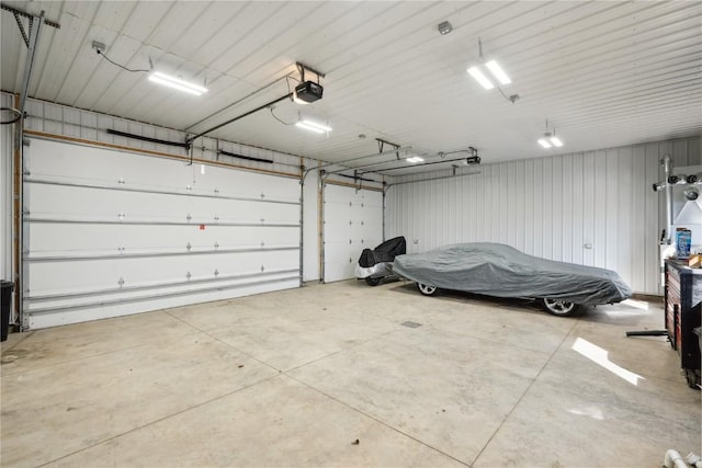1305 W 4th St, Vinton, IA 52349 - garage with metal wall and a garage door opener