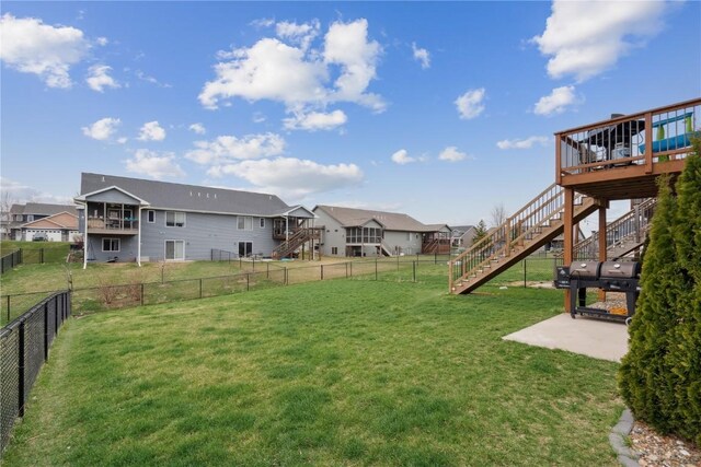 621 Doe Ave, Tiffin, IA 52340 - view of yard featuring stairway, a wooden deck, a fenced backyard, and a residential view