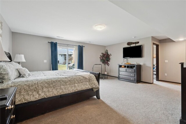 621 Doe Ave, Tiffin, IA 52340 - bedroom with light carpet, visible vents, and baseboards