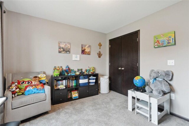 621 Doe Ave, Tiffin, IA 52340 - rec room with light colored carpet