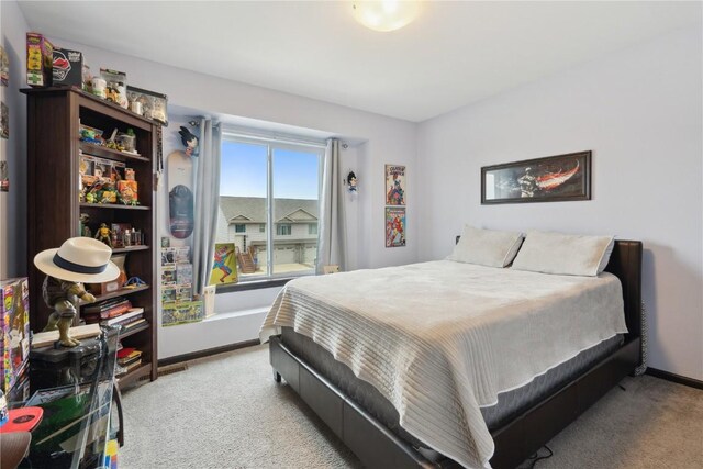 621 Doe Ave, Tiffin, IA 52340 - carpeted bedroom with baseboards