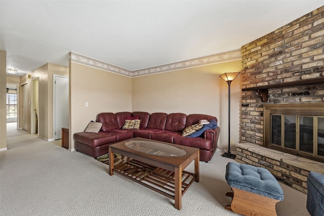 carpeted living area featuring baseboards and a fireplace