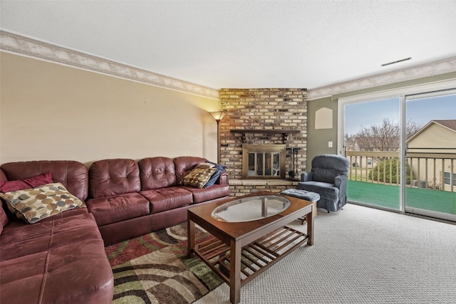 carpeted living room with a textured ceiling, visible vents, and a brick fireplace