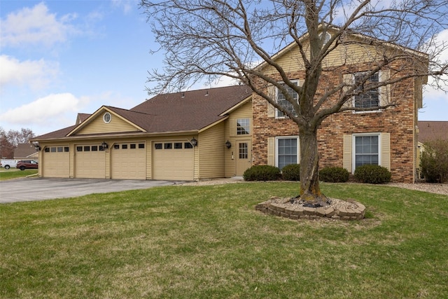 view of front facade with a front lawn, an attached garage, and aphalt driveway
