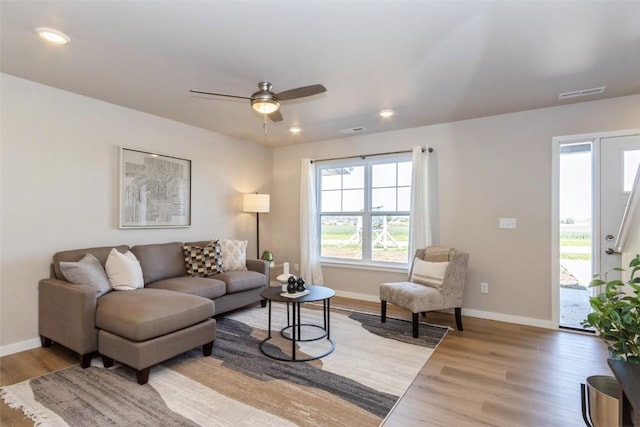 7014 C St SW, Cedar Rapids, IA 52404 - living area featuring healthy amount of natural light, wood finished floors, baseboards, and recessed lighting