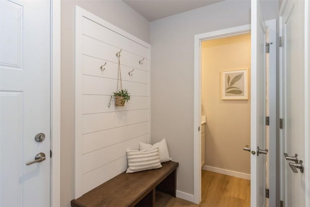 7014 C St SW, Cedar Rapids, IA 52404 - mudroom featuring light wood-type flooring and baseboards