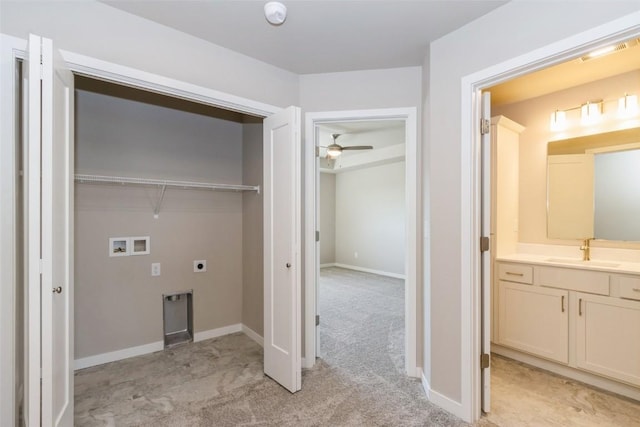 7014 C St SW, Cedar Rapids, IA 52404 - washroom featuring electric dryer hookup, washer hookup, light colored carpet, a ceiling fan, and baseboards