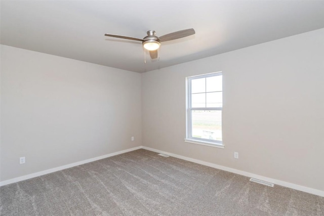 7014 C St SW, Cedar Rapids, IA 52404 - unfurnished room featuring carpet, baseboards, and ceiling fan