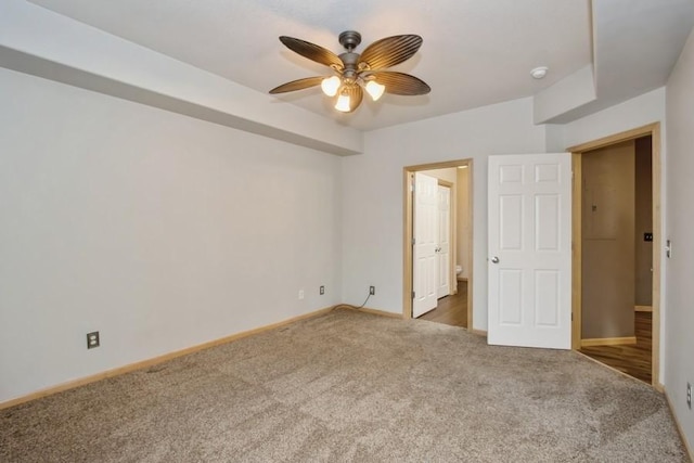unfurnished bedroom with carpet flooring, baseboards, and ceiling fan