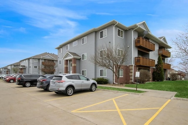 view of property with uncovered parking