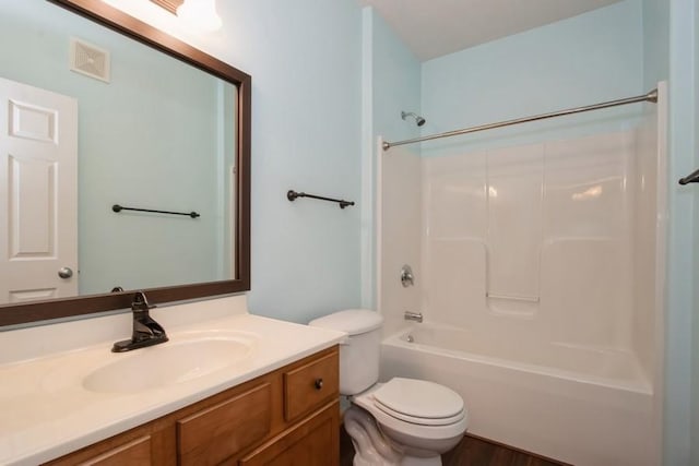 full bath featuring  shower combination, visible vents, toilet, and vanity