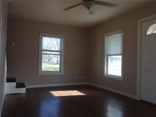 549 Marengo Ave, Marengo, IA 52301 - spare room with baseboards, a ceiling fan, and wood finished floors