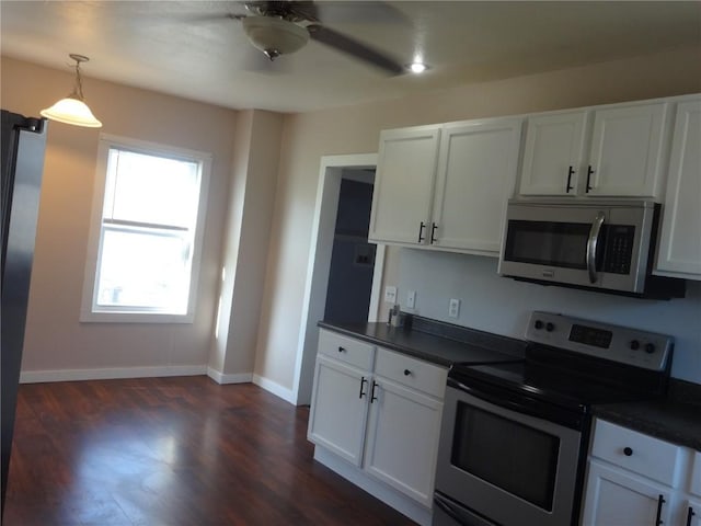 549 Marengo Ave, Marengo, IA 52301 - kitchen with white cabinetry, ceiling fan, dark countertops, and stainless steel appliances