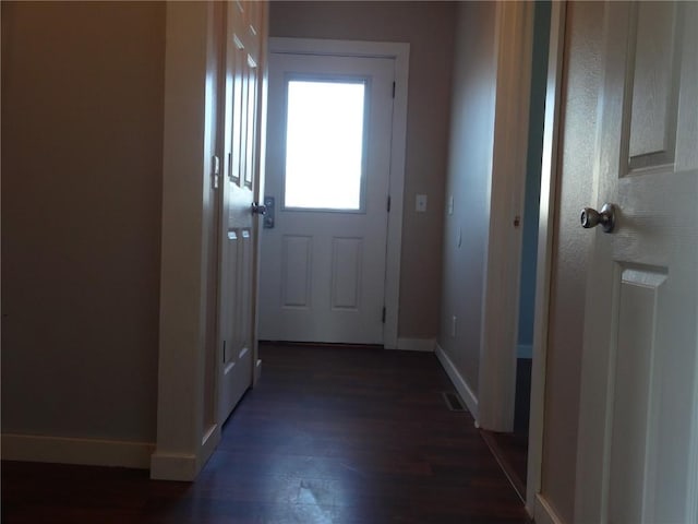 549 Marengo Ave, Marengo, IA 52301 - doorway to outside with dark wood-style floors and baseboards