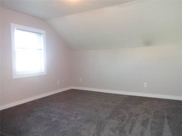 549 Marengo Ave, Marengo, IA 52301 - bonus room with carpet flooring, baseboards, and lofted ceiling