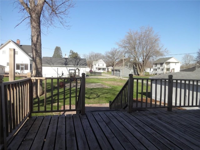 549 Marengo Ave, Marengo, IA 52301 - wooden terrace with a fenced backyard, a residential view, and a lawn