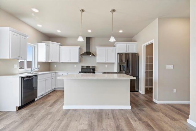 1306 E Gable Way, Tiffin, IA 52340 - kitchen with wall chimney exhaust hood, stainless steel appliances, a kitchen island, light wood-style flooring, and white cabinetry