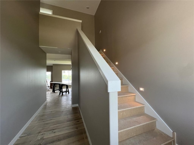 1306 E Gable Way, Tiffin, IA 52340 - staircase featuring baseboards and wood finished floors
